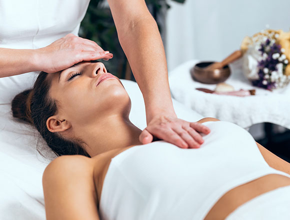 hands performing energy healing in a calming environment with a focus on relaxation and holistic wellness techniques 3 benefits of healing